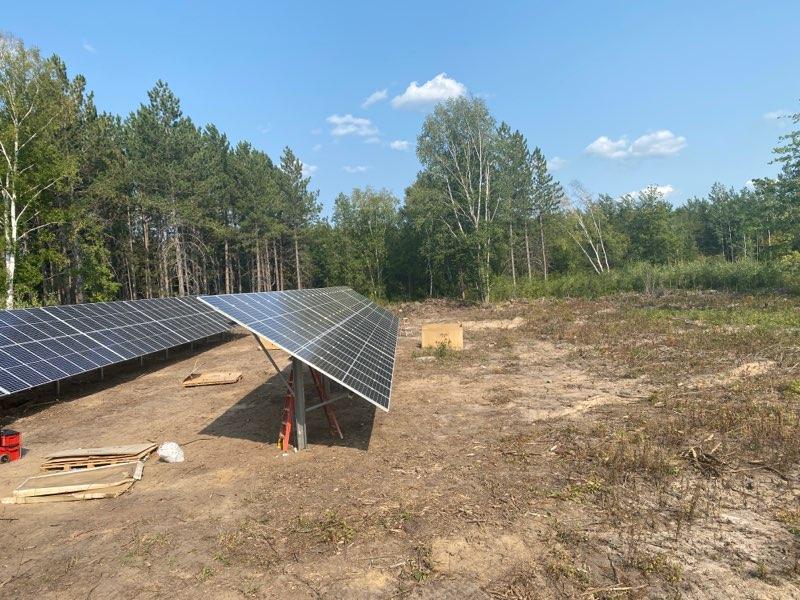 New solar panels arranged in the woods